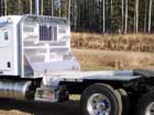 Truck deck - The vented aluminum walking deck allows the mud to fall through, and provides a safe walking surface. A toolbox and handles on the checkerplate headache rack make for convenient storage, with our unique tire chain hanger design allowing easier access to bulky, awkward chains.